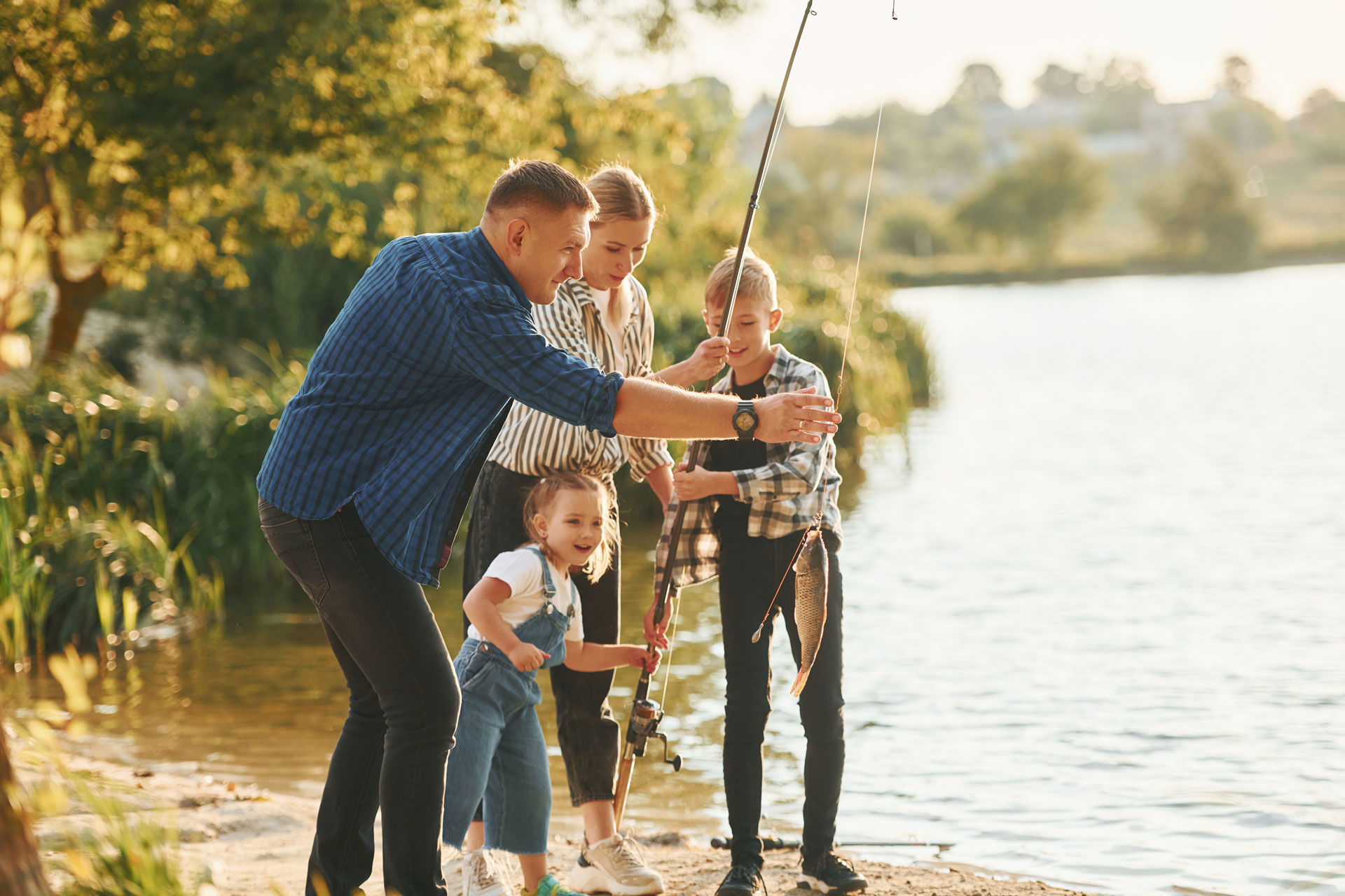 family fishing on the lake